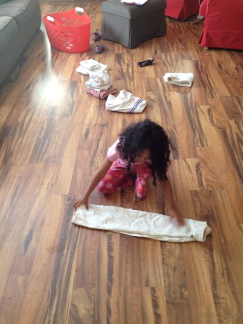 Girl folding laundry